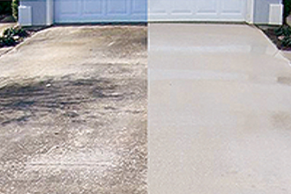 Picture of a concrete driveway
	before and after being Squeegee Cleaned.